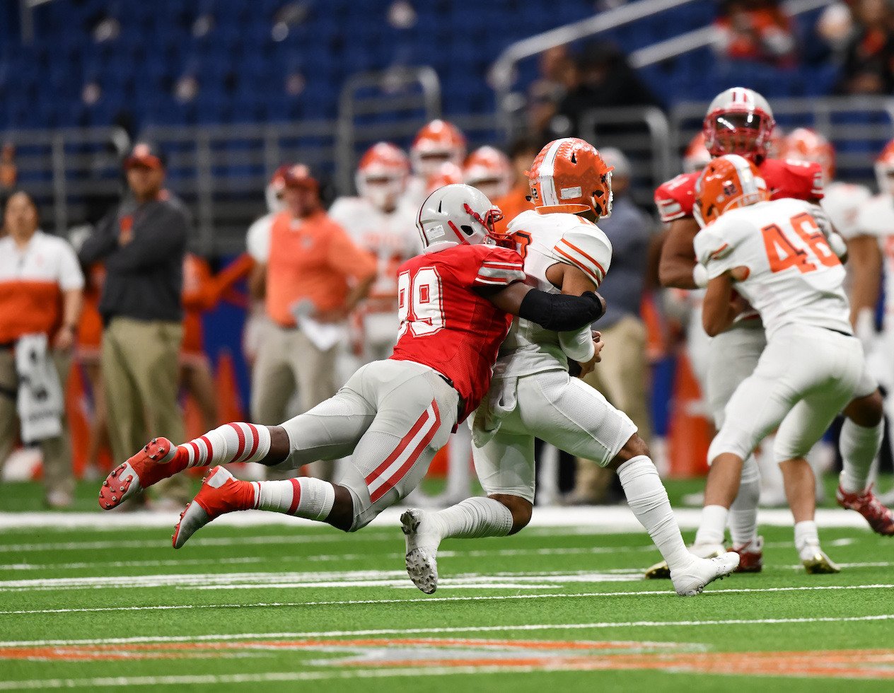 Action photo of football players making amazing play during a football game